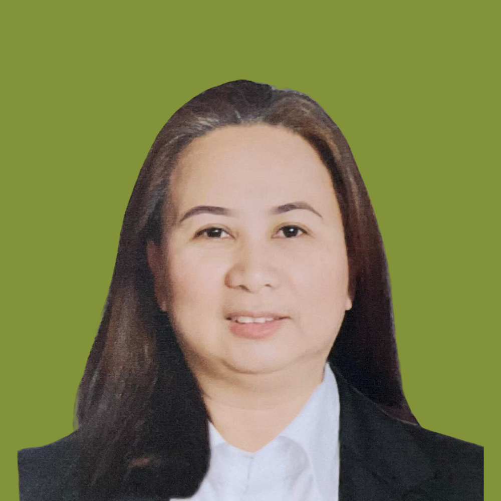 Professional headshot of a woman with long dark hair, wearing a white collared shirt and black blazer, against a green background.