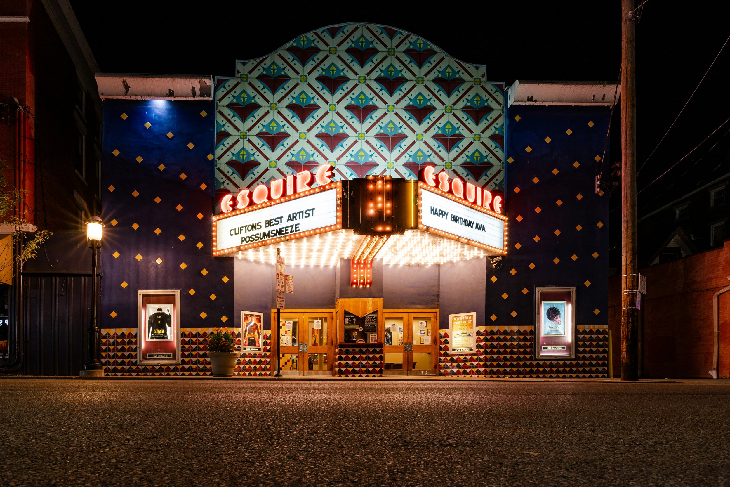 Cincinnati storefront illuminated with warm evening lighting
