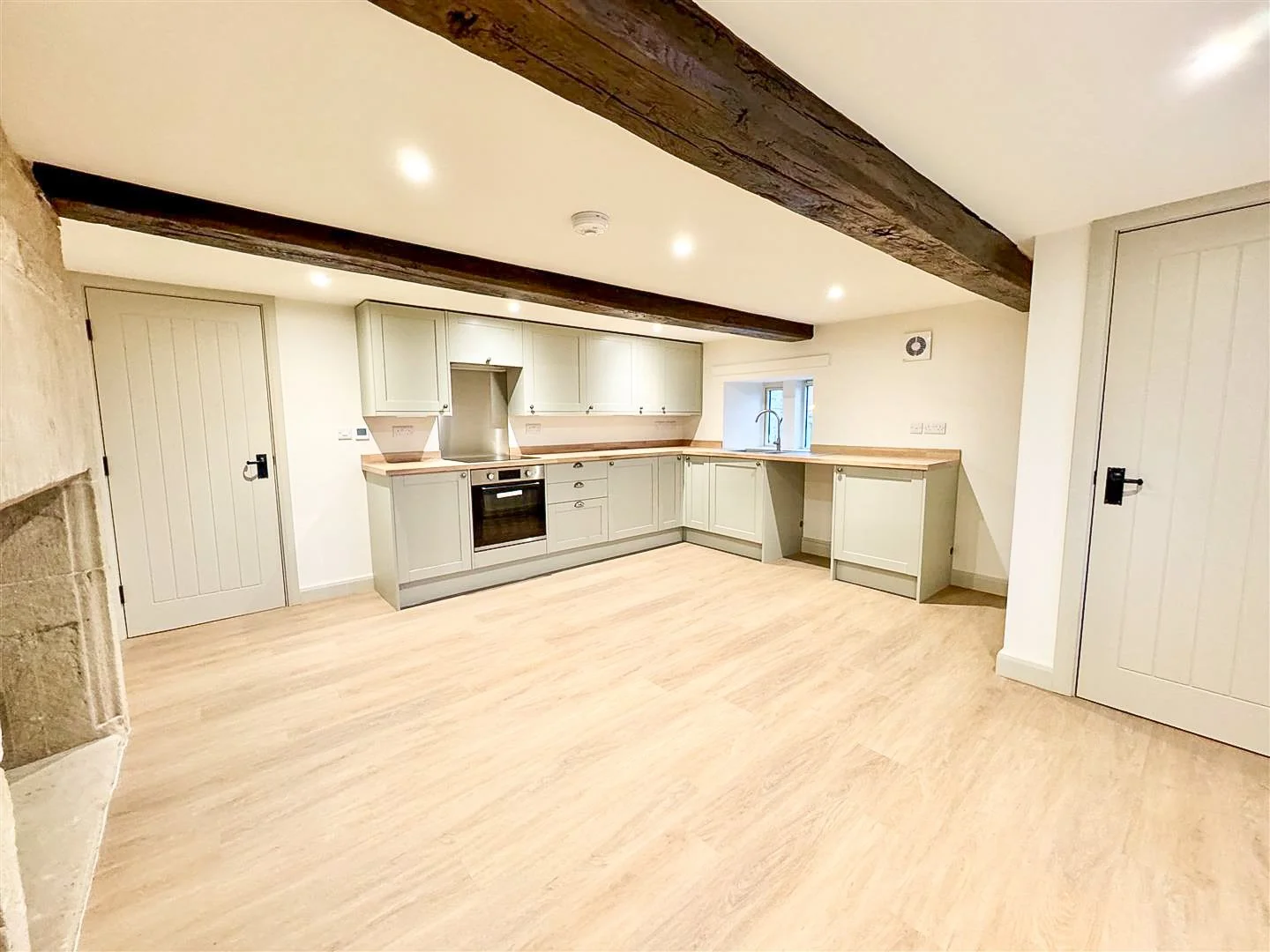 Open-plan kitchen and living space created during the renovation of a traditional home.