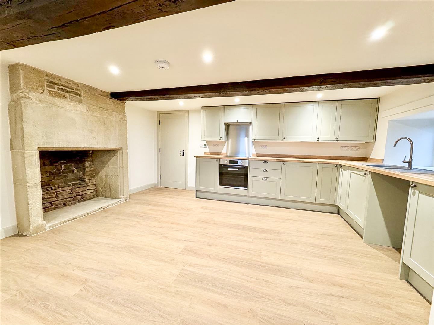Open-plan kitchen and living space created during the renovation of a traditional home.