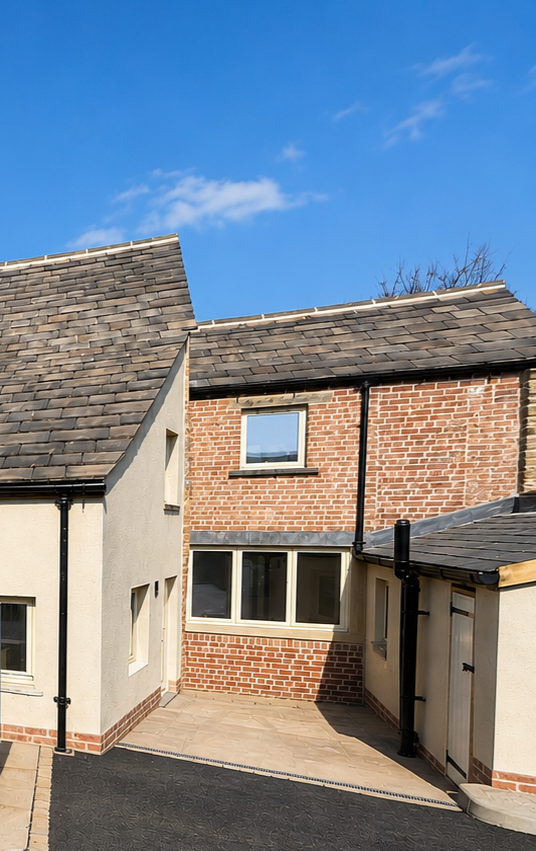 Side elevation of the completed residential property conversion with new external finishes.