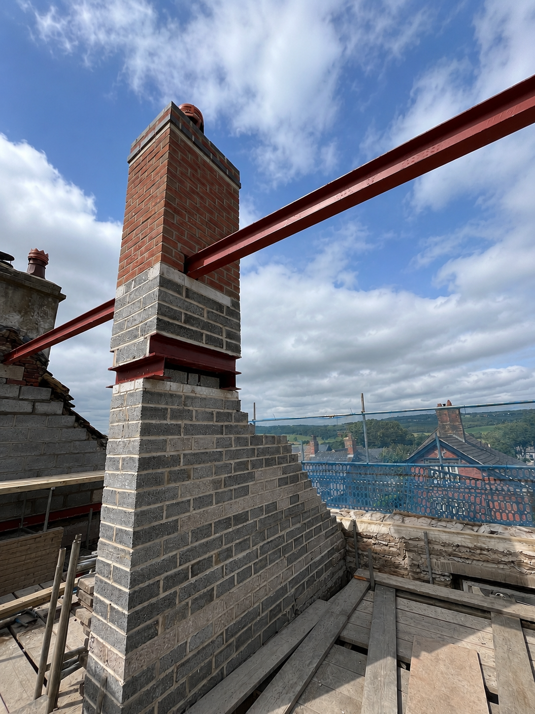 Chimney reconstruction completed during the property conversion project.