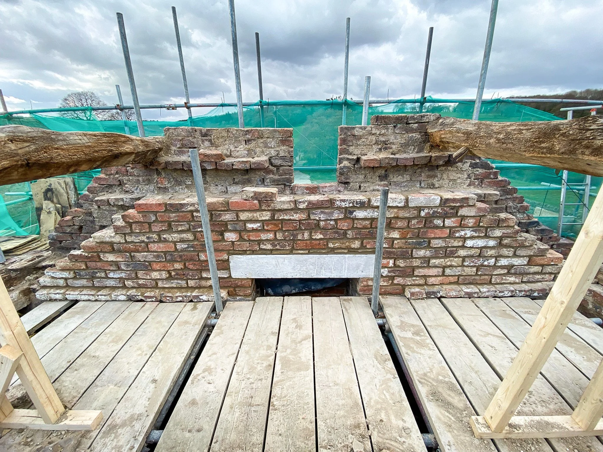 Traditional brick and stone masonry repairs completed during the barn restoration.