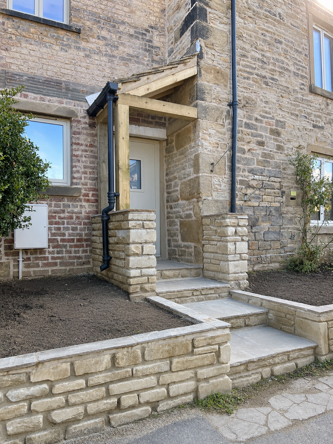 New entrance and stone steps completed as part of the property conversion.