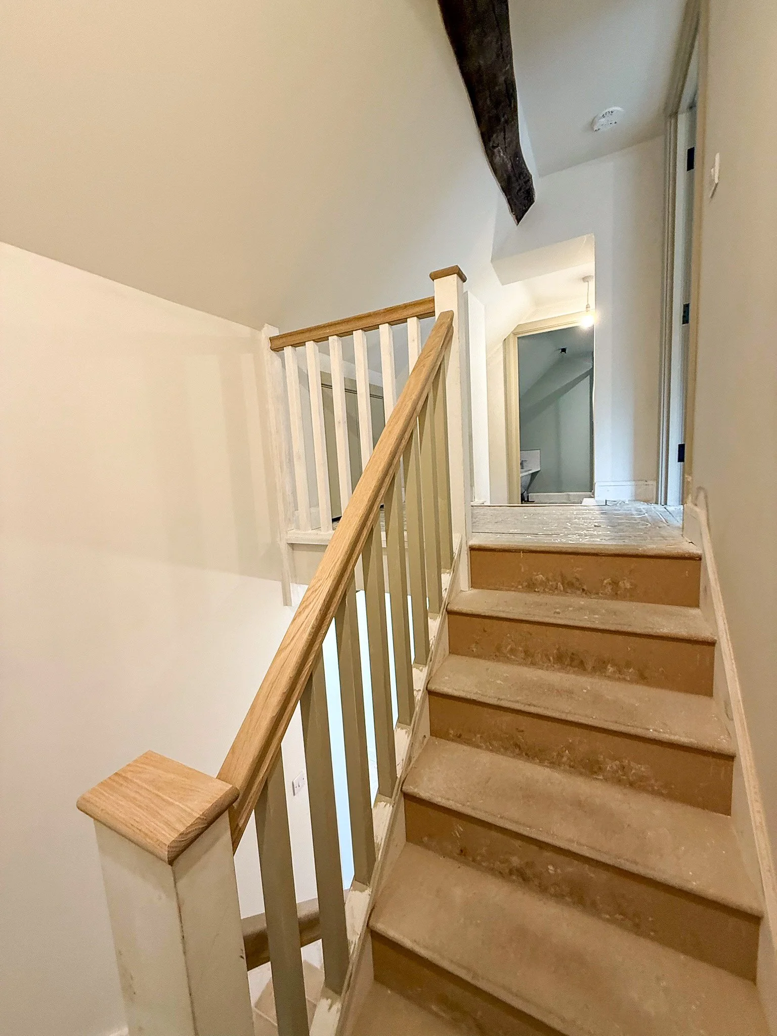 Newly installed timber staircase completed during the house renovation.