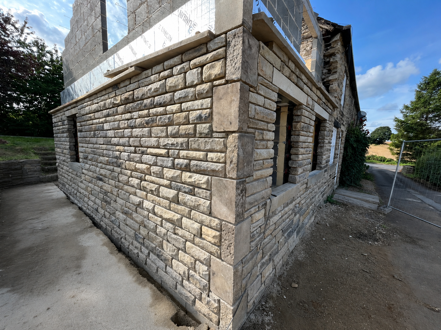 Traditional stone property with a completed double storey side extension