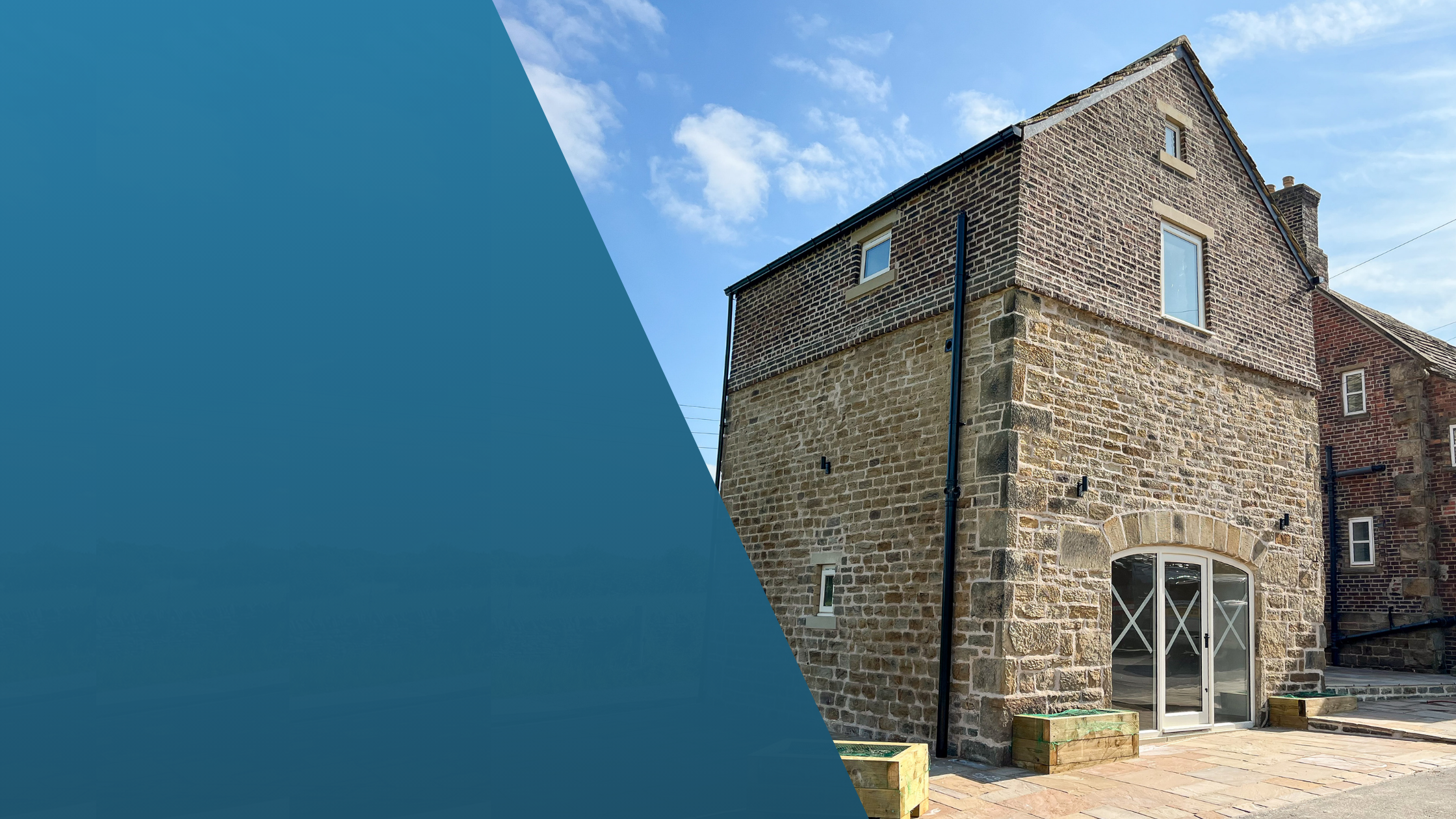 Restored traditional stone building completed by Price Contracting, showcasing heritage restoration, structural alterations and high-quality construction.