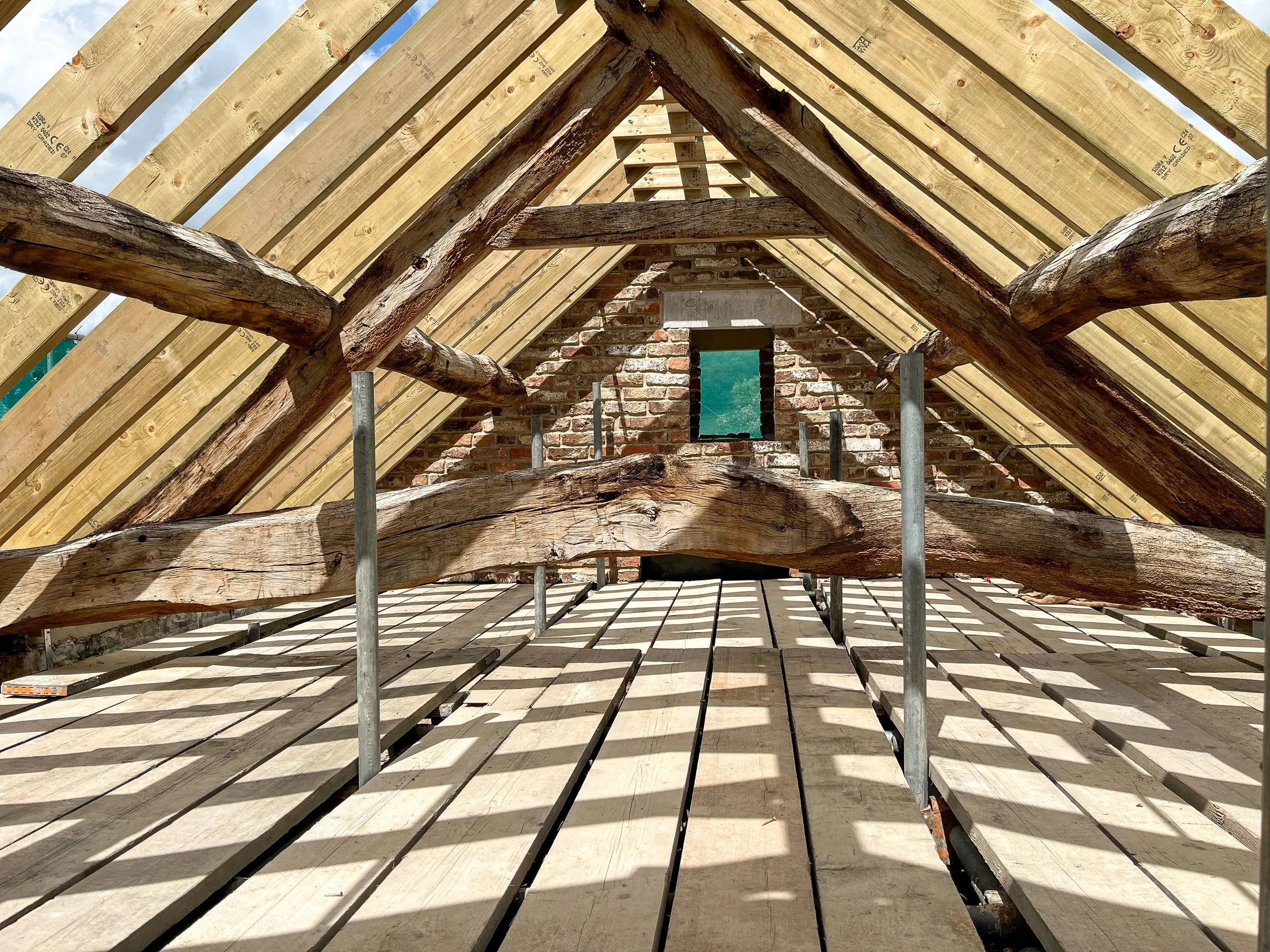 Traditional roof timbers retained as part of the barn restoration works.