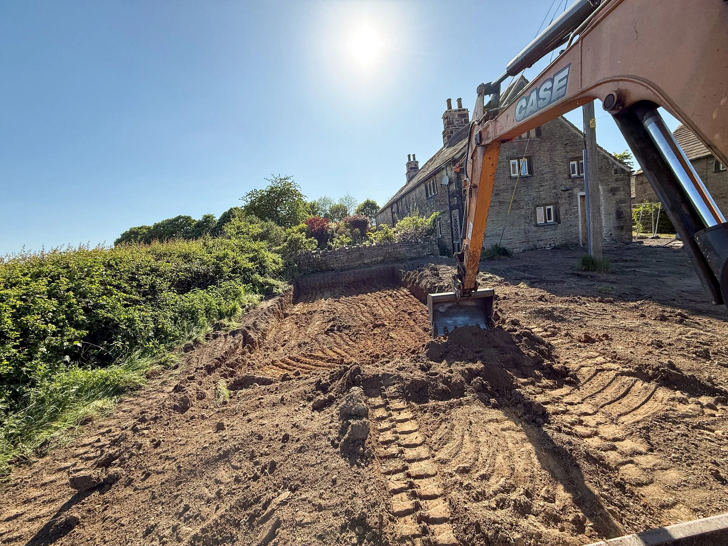 Groundworks and site preparation carried out during the house renovation project.
