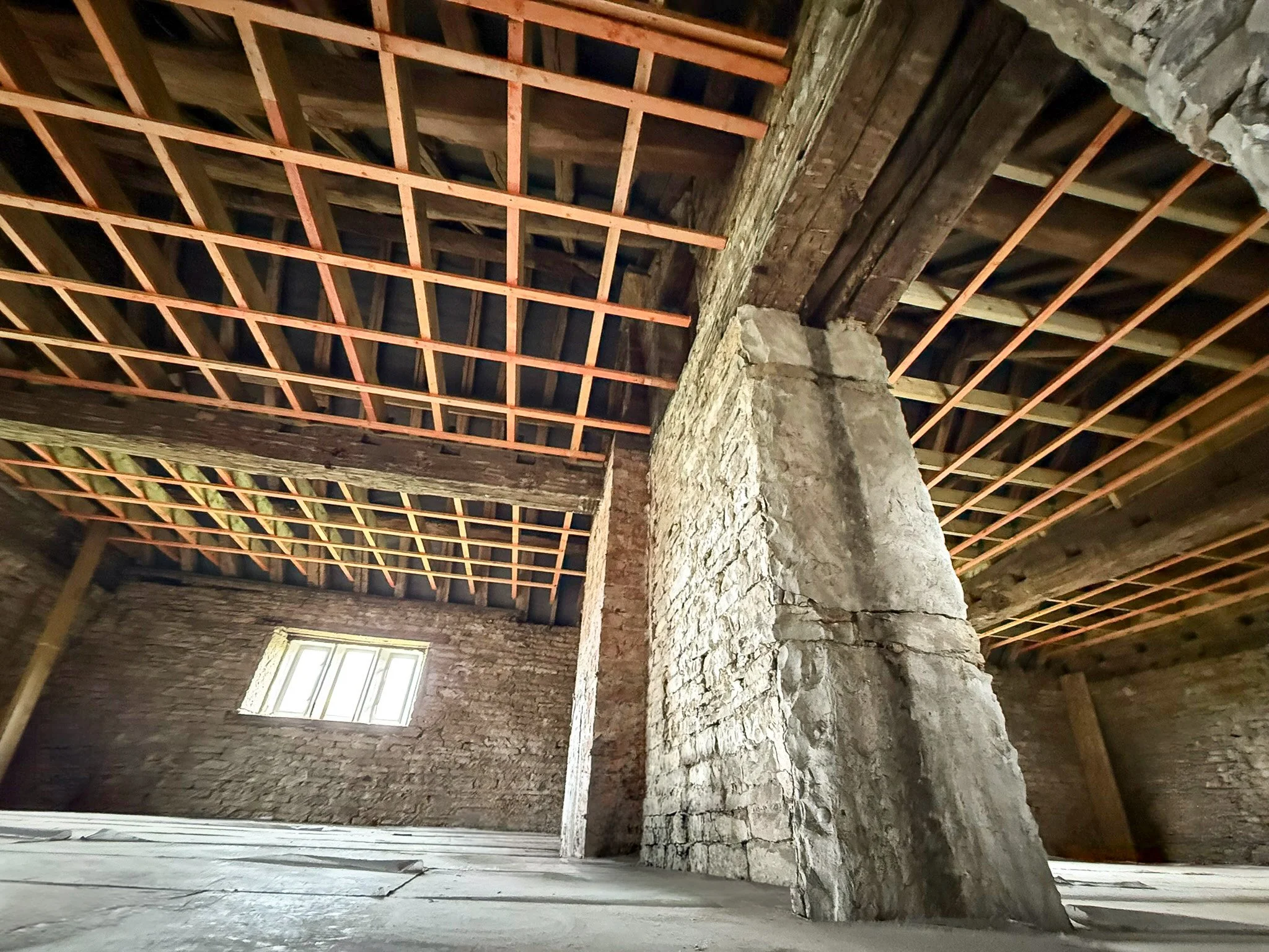 Original timber roof structure exposed during renovation works.