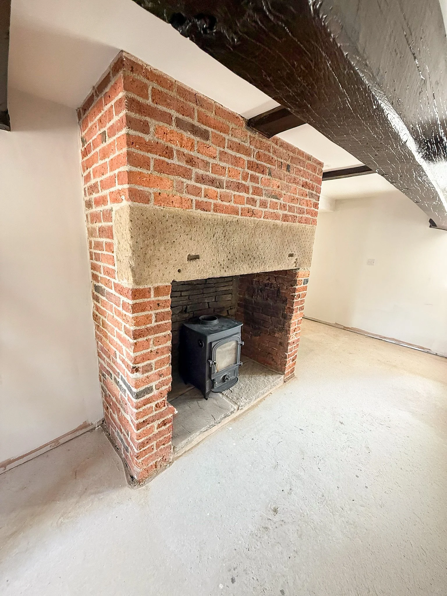 Traditional brick fireplace restored as part of a complete house renovation.