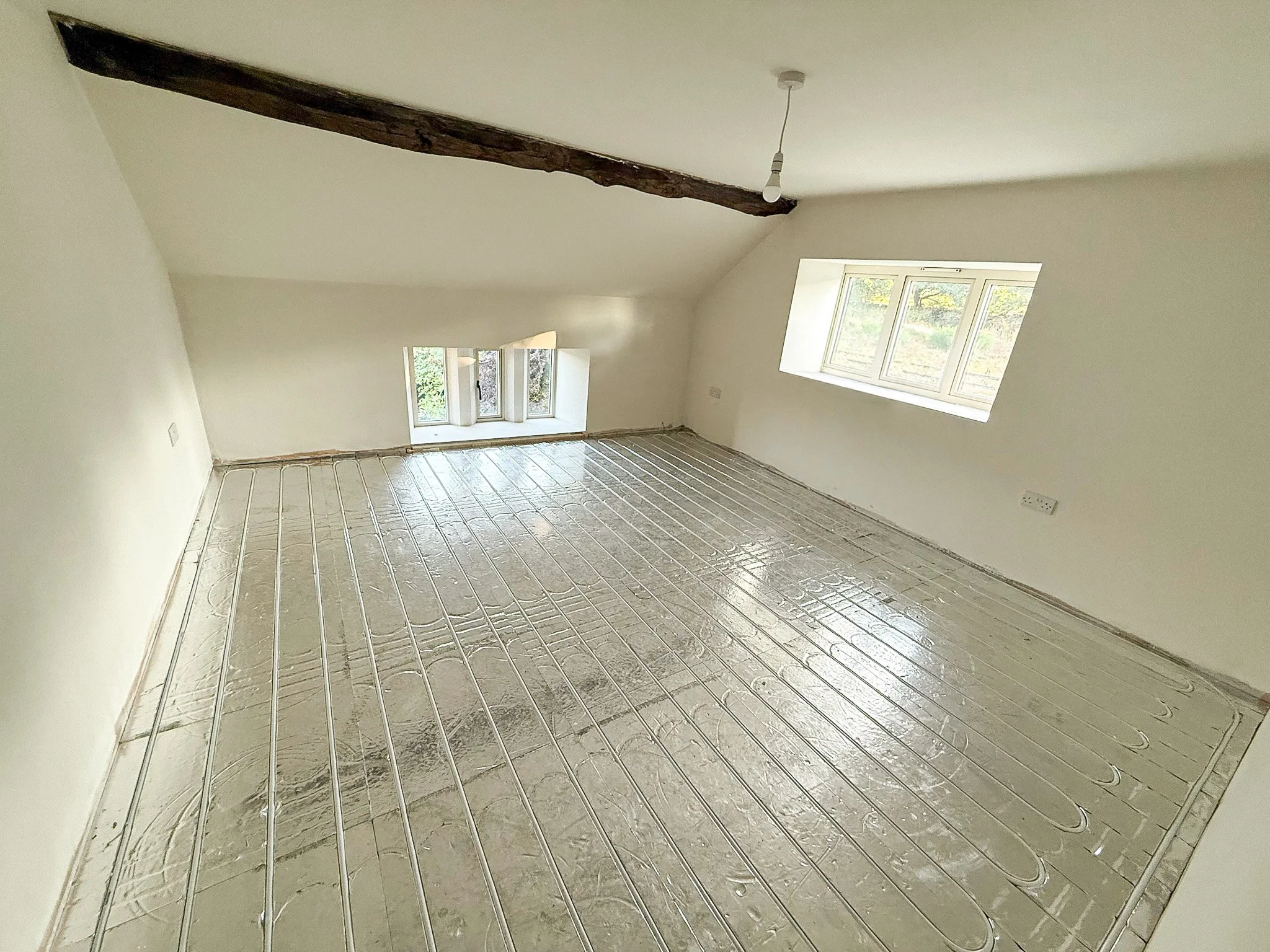 Bright refurbished room completed during the renovation of a traditional property.