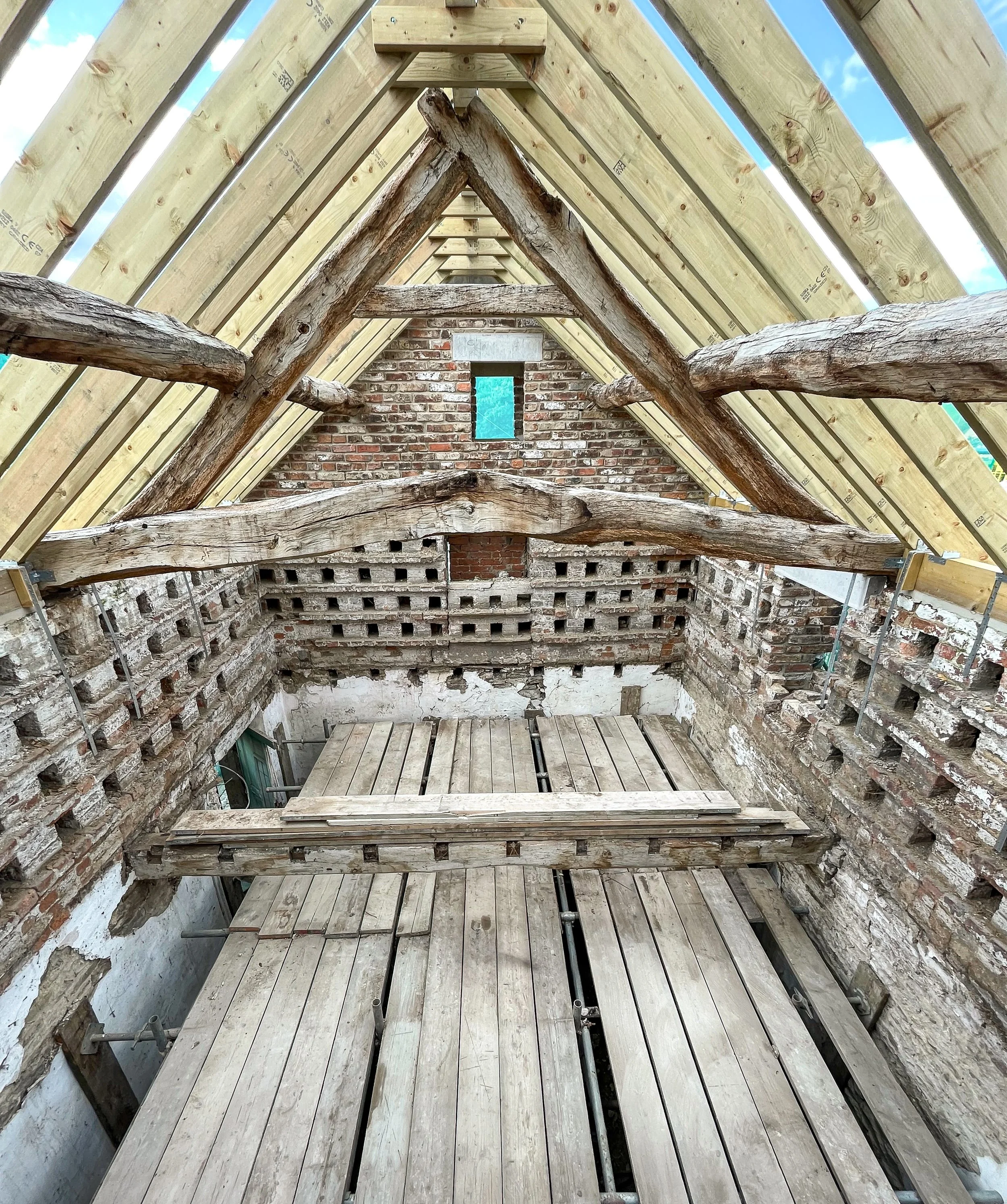 Original timber roof structure exposed during the barn conversion.
