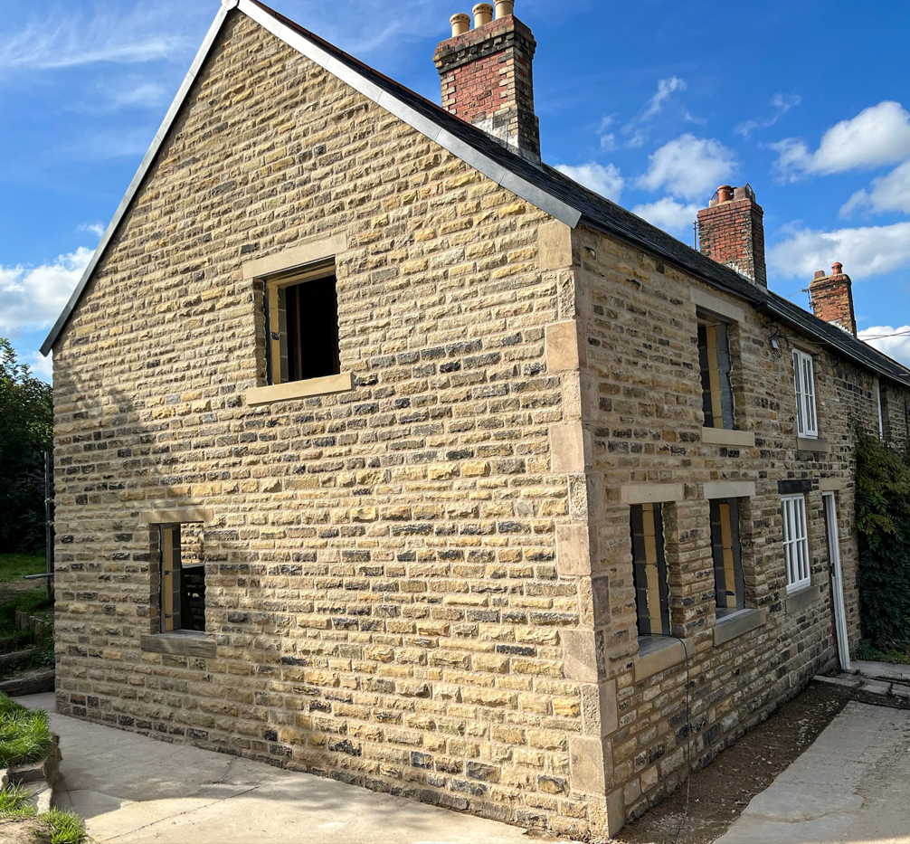 Traditional stone double storey side extension designed to blend seamlessly with the existing property.