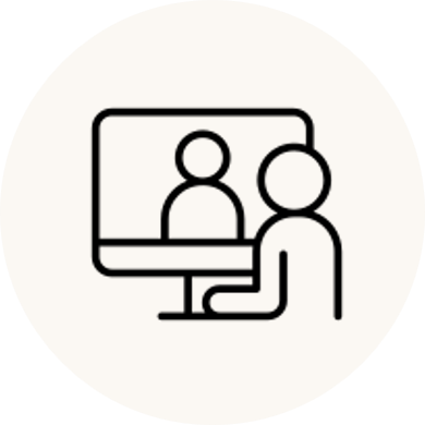 Person participating in a video conference or online meeting on a computer.