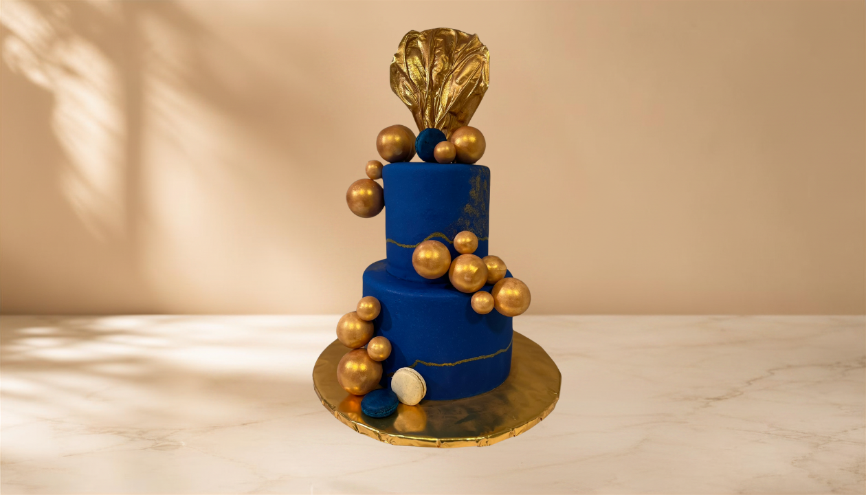 blue and gold wedding cake.png