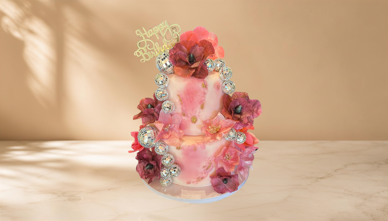Pink flower and disco ball cake.png