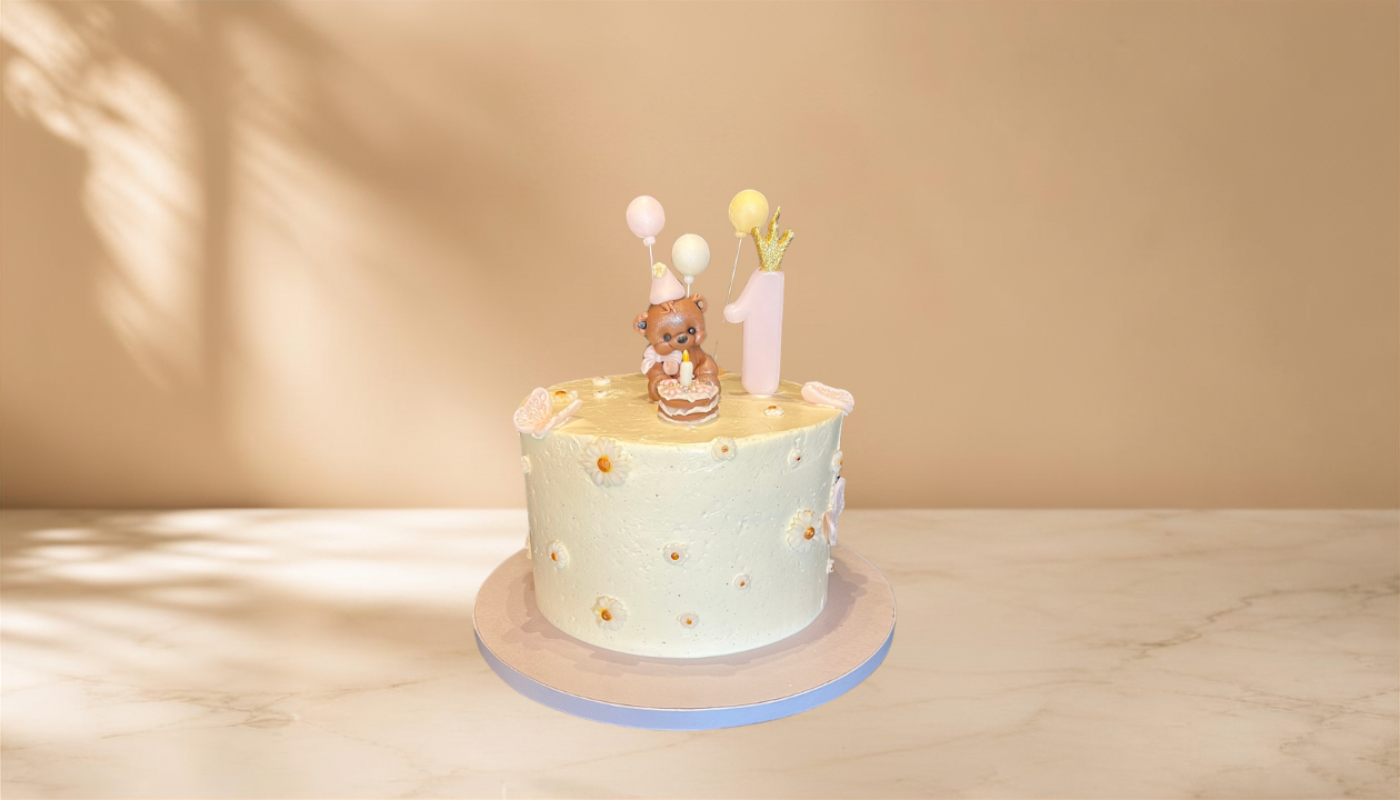 1st birthday with small bear.png