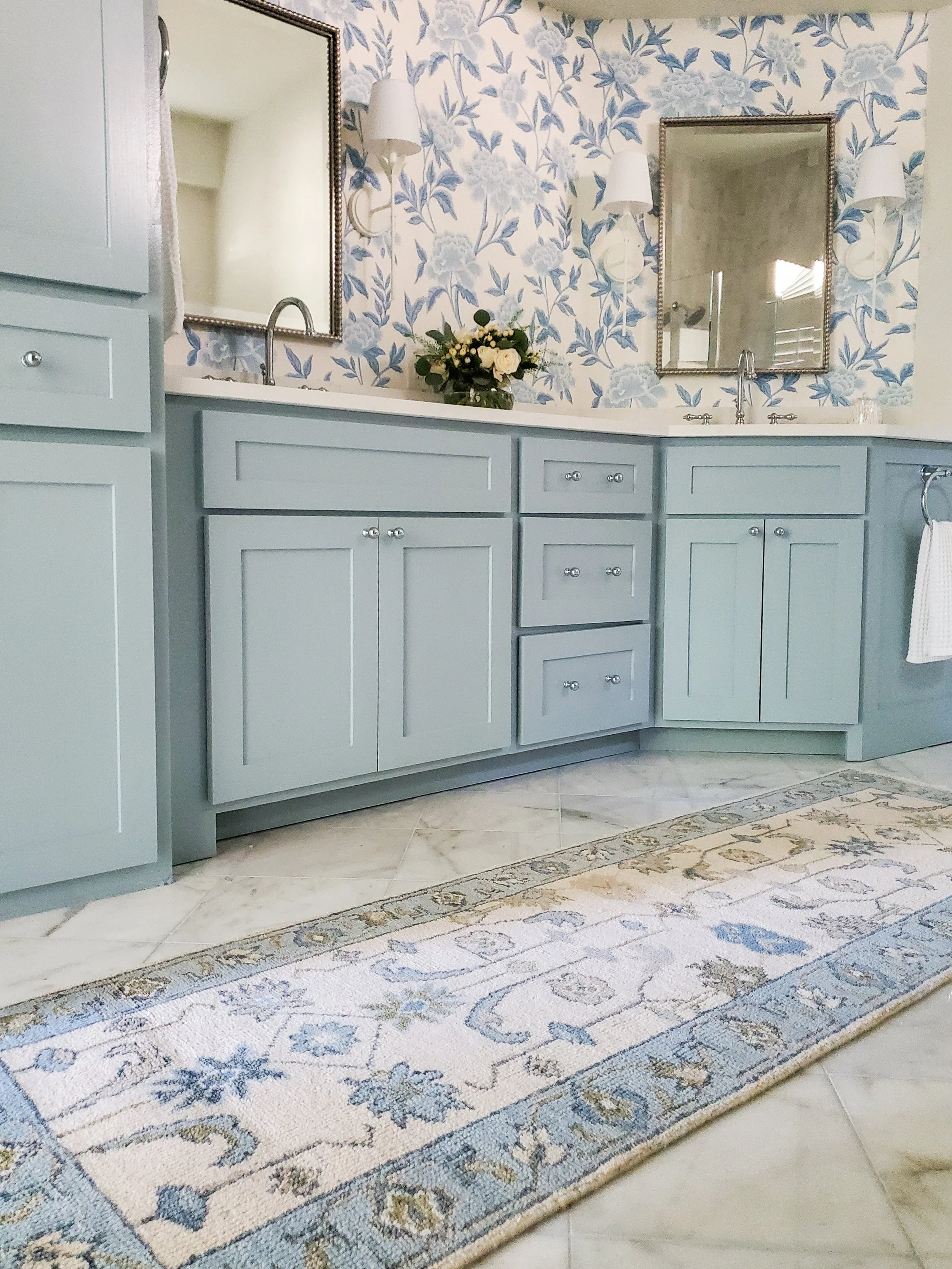 Primary Bathroom Vanity Painted Light Blue with Blue and White Floral Wallpaper