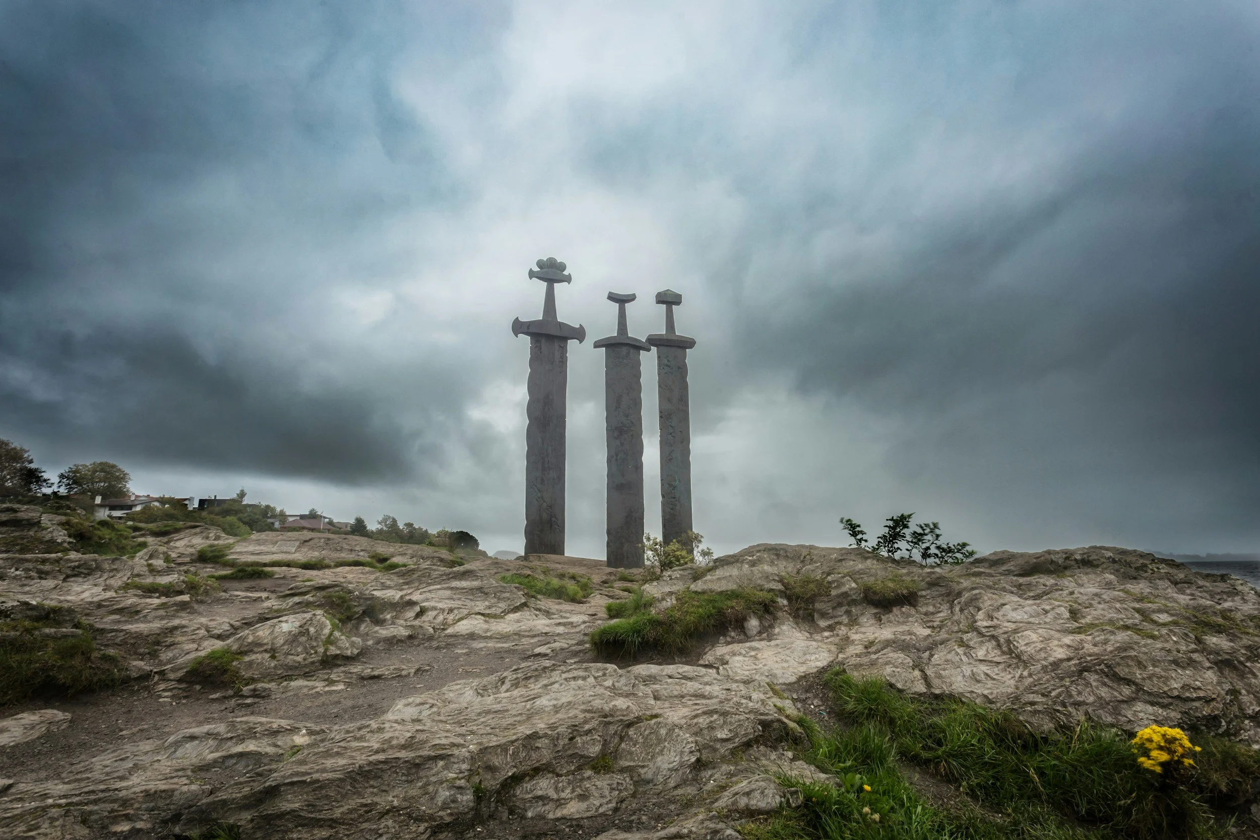 The three Viking swords in stone monument in Norway, symbolizing strength, unity, and heritage.  A part of the Modern Viking Woman Scandinavian wellness series.