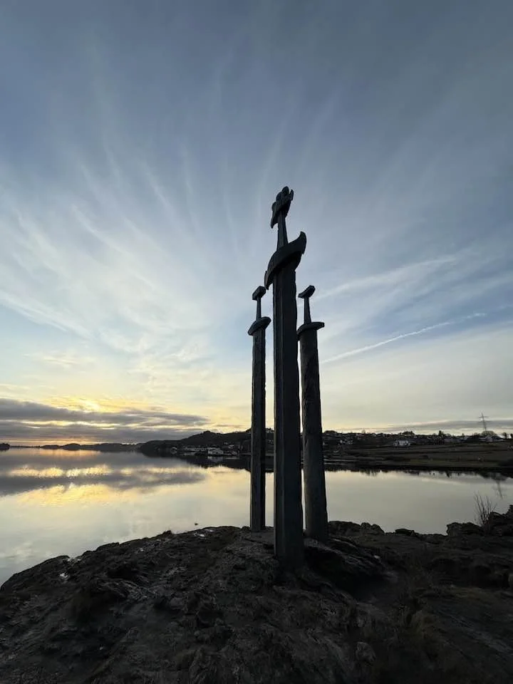 A Scandinavian landmark symbolizing strength, heritage, and clarity. The three swords stand in calm coastal light, reflecting the Nordic roots and grounded presence behind Sissel Bridges’ wellness writing