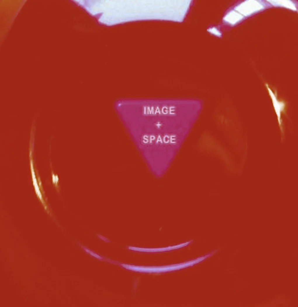 Red surface with a pink triangle button labeled 'IMAGE' and 'SPACE' in white text.