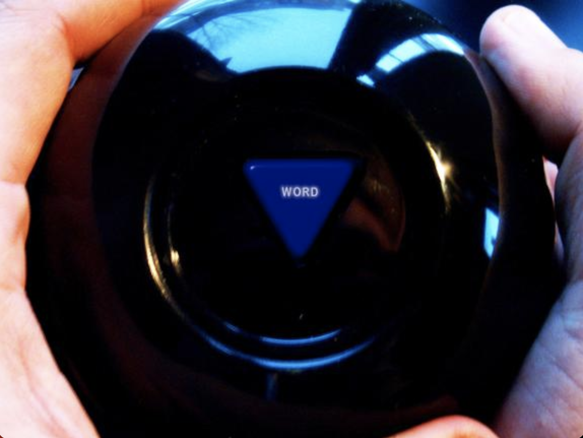 A person holding a black device with a blue triangular button labeled 'WORD' in the center.