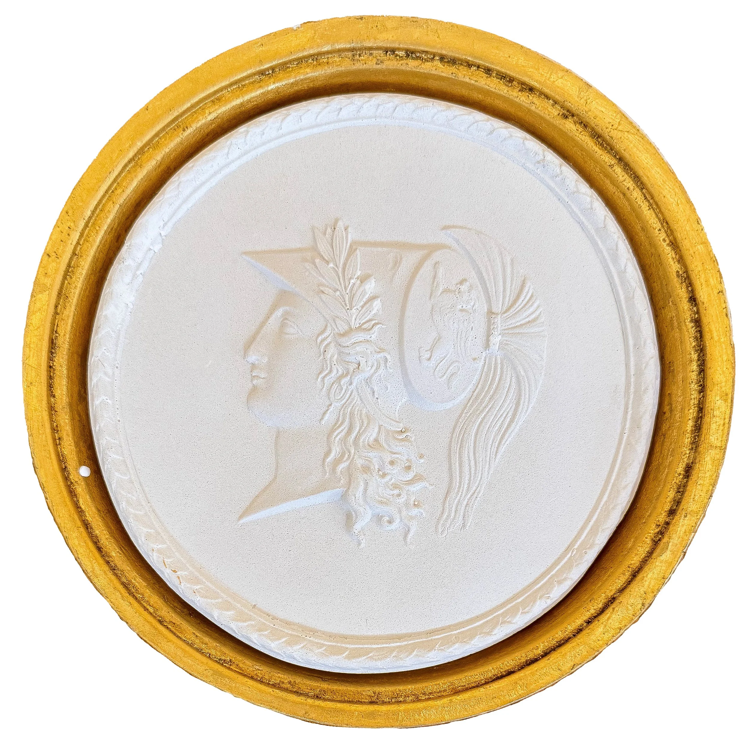 Close-up of a decorative oval ceramic wall plaque with embossed floral design, framed by an ornate gold-colored border.