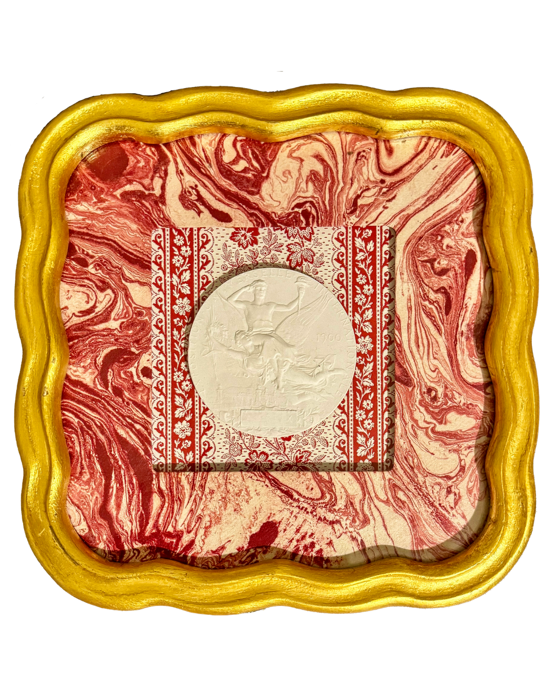 A marble-like square with red and white marbling design, featuring a silver coin in the center, placed inside a decorative box with a wavy gold-colored border.