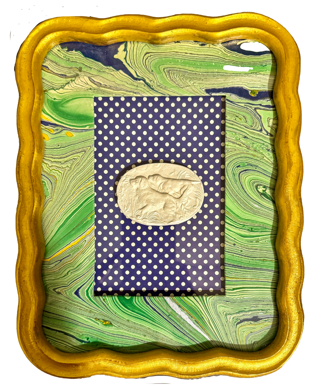 A decorative picture frame with a yellow wavy border, green and black marbled background, and a navy blue and white polka dot card featuring a white embossed illustration of a dog.