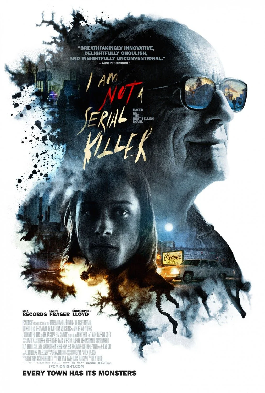 Movie poster for "I Am Not a Serial Killer" showing a close-up of a smiling older man with glasses, a young woman, a cityscape, and a pet tattoo, with the tagline "Every Town Has Its Monsters."