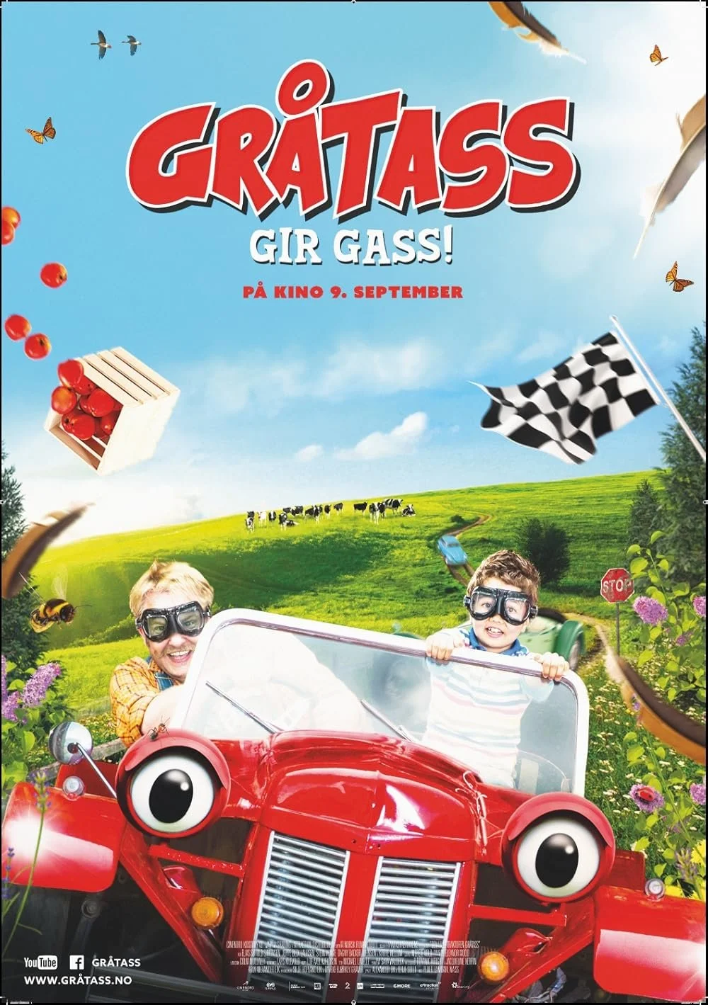 A colorful animated poster for the movie "Gråtass gir Gass" featuring a red cartoon car with large eyes on the headlights, two children wearing goggles riding in the car, a green countryside with cows, butterflies, bees, a checkered flag, a stop sign, and a crate of red tomatoes flying in the sky.
