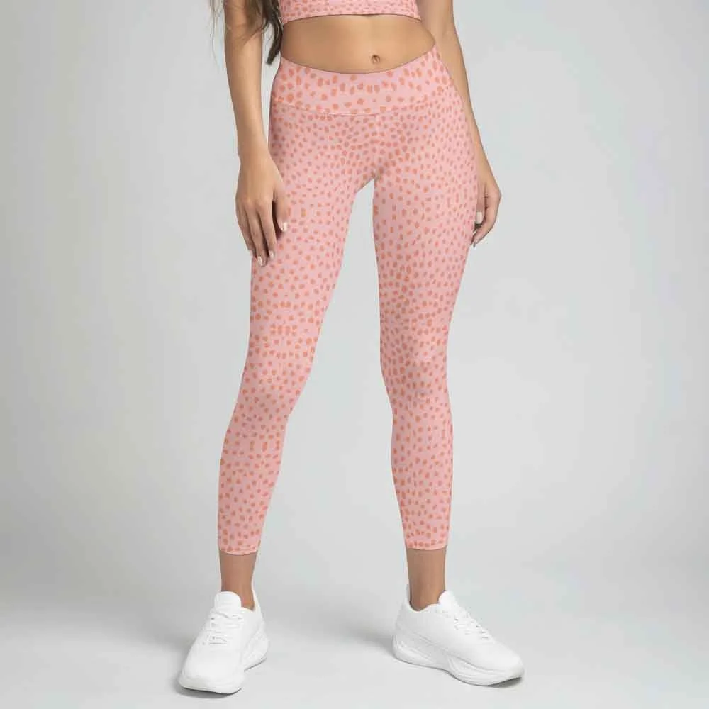 A woman wearing pink leggings with original pattern by Studio Victoria Louise.
