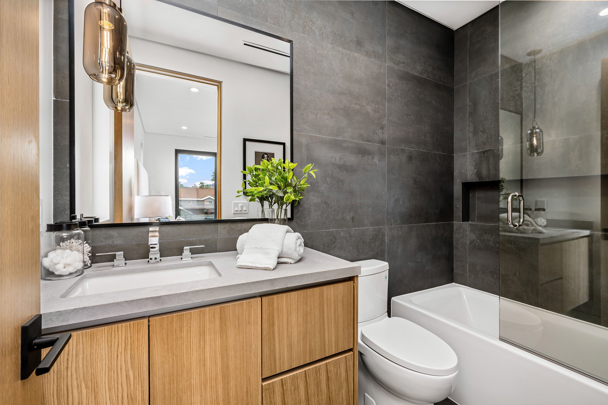 modern-bathroom-interior-with-wood-cabinets-and-mi-2026-01-07-23-12-42-utc.jpg