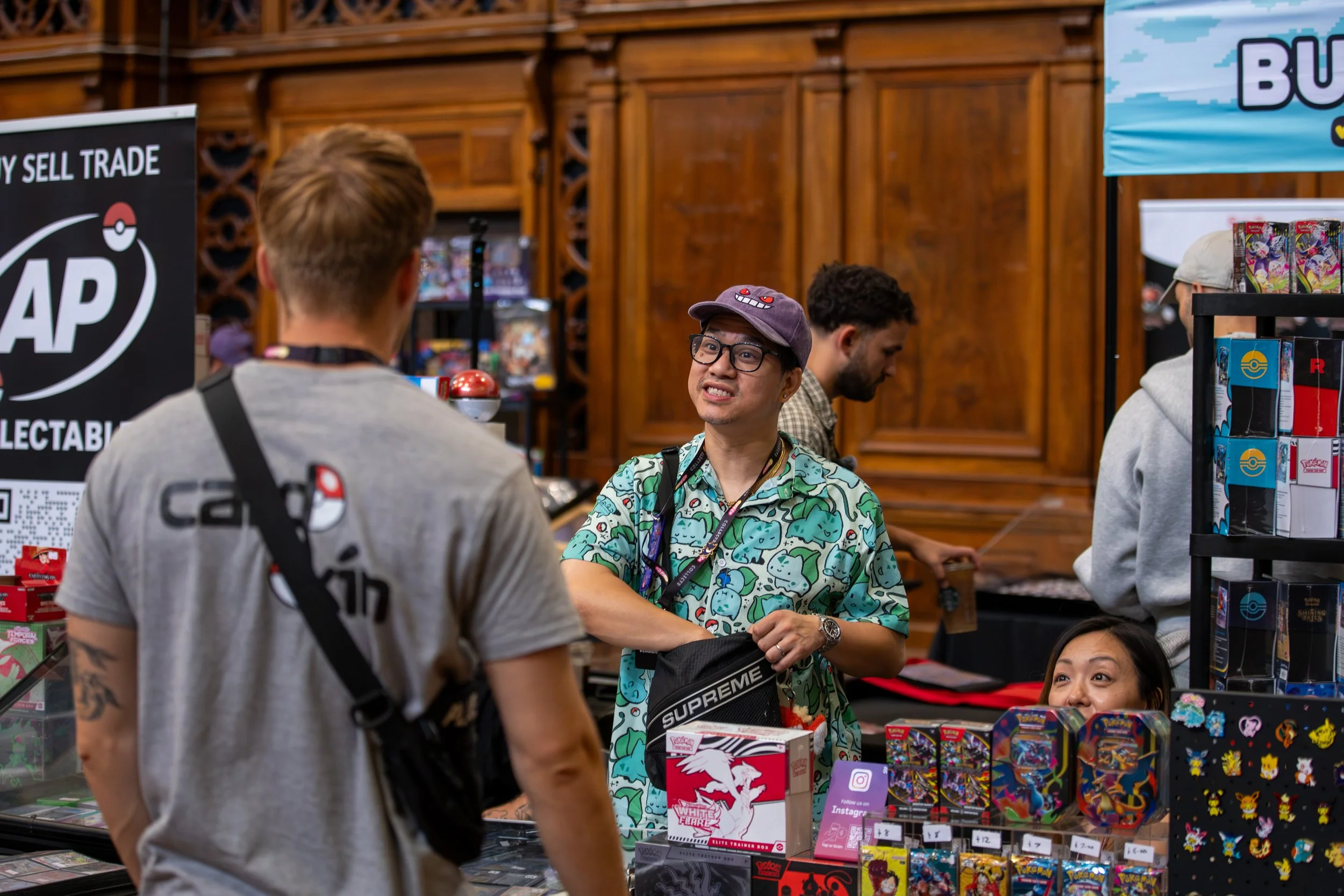 Vendors interact with a customer at the Cardco events Southampton show.