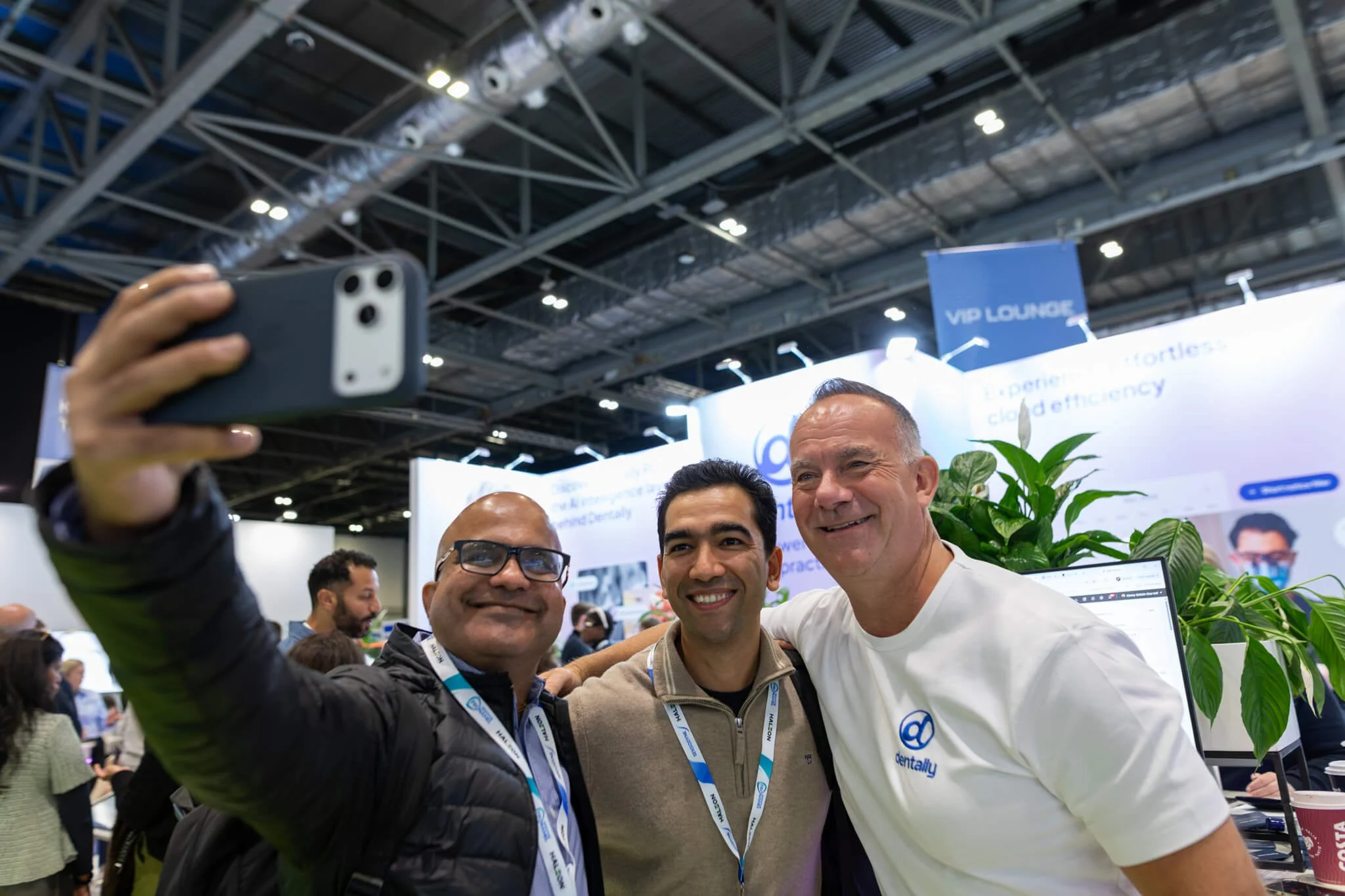 Guest pose for a selfie captured by event photographer at the excel in london