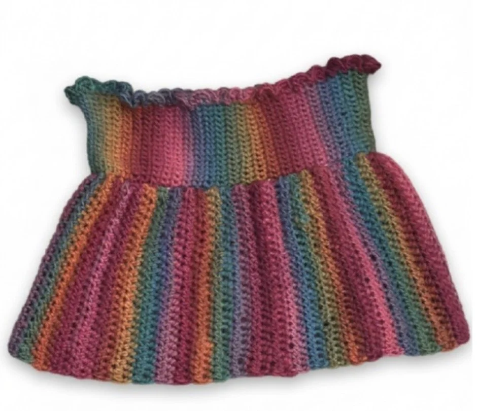 Colorful, small, hand-crocheted baby doll top.