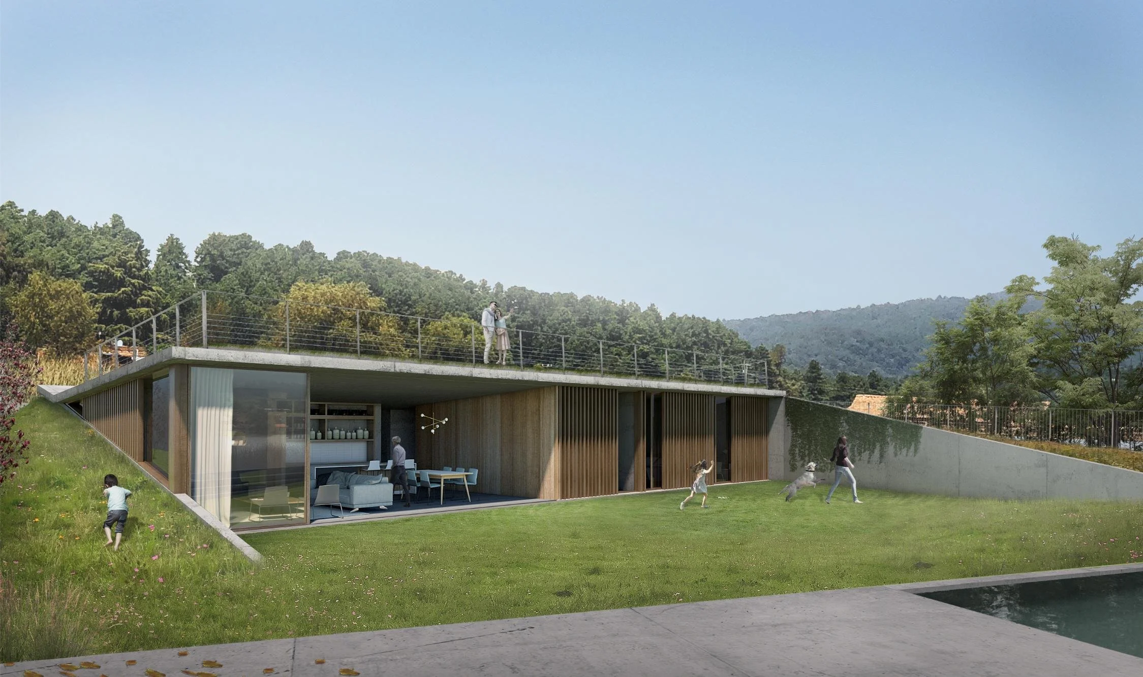 Modern subterranean house with open living spaces, concrete roof deck, and a family playing on the lawn