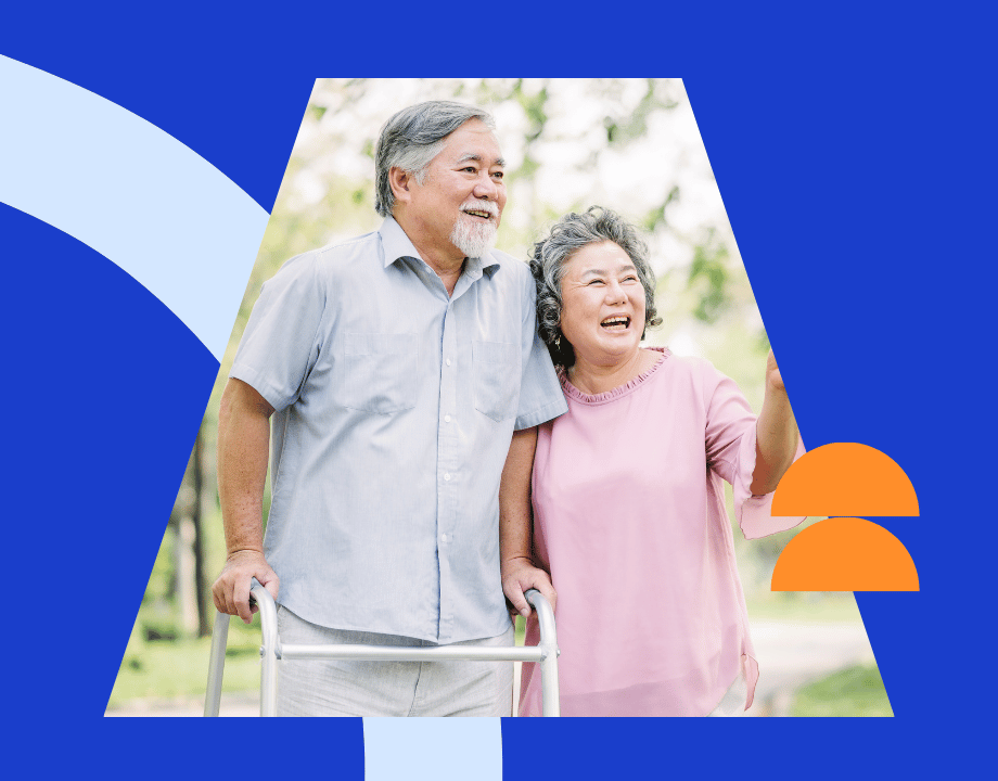 An older couple walking outdoors with a walker, representing Eastside clients with limited mobility receiving in-home care.