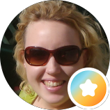 A smiling client who left a 5-star review for their in-home clinical massage experience on the Eastside.