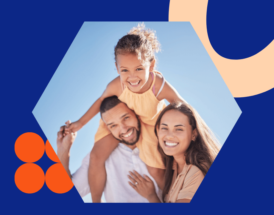 Two smiling parents with a child on their shoulders, representing busy Eastside families who utilize in-home clinical massage.