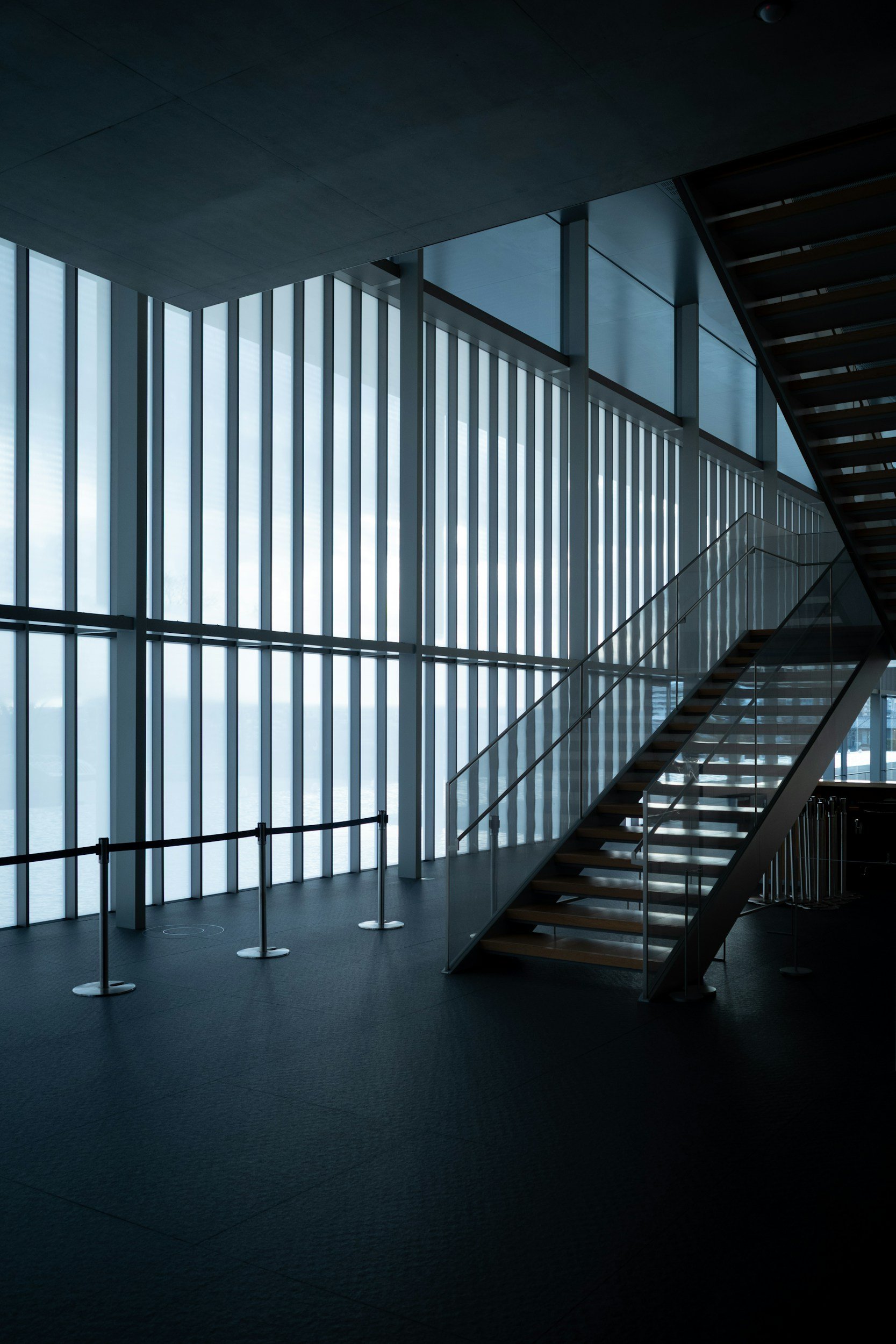Modern interior with vertical PVC blinds for light control and privacy.