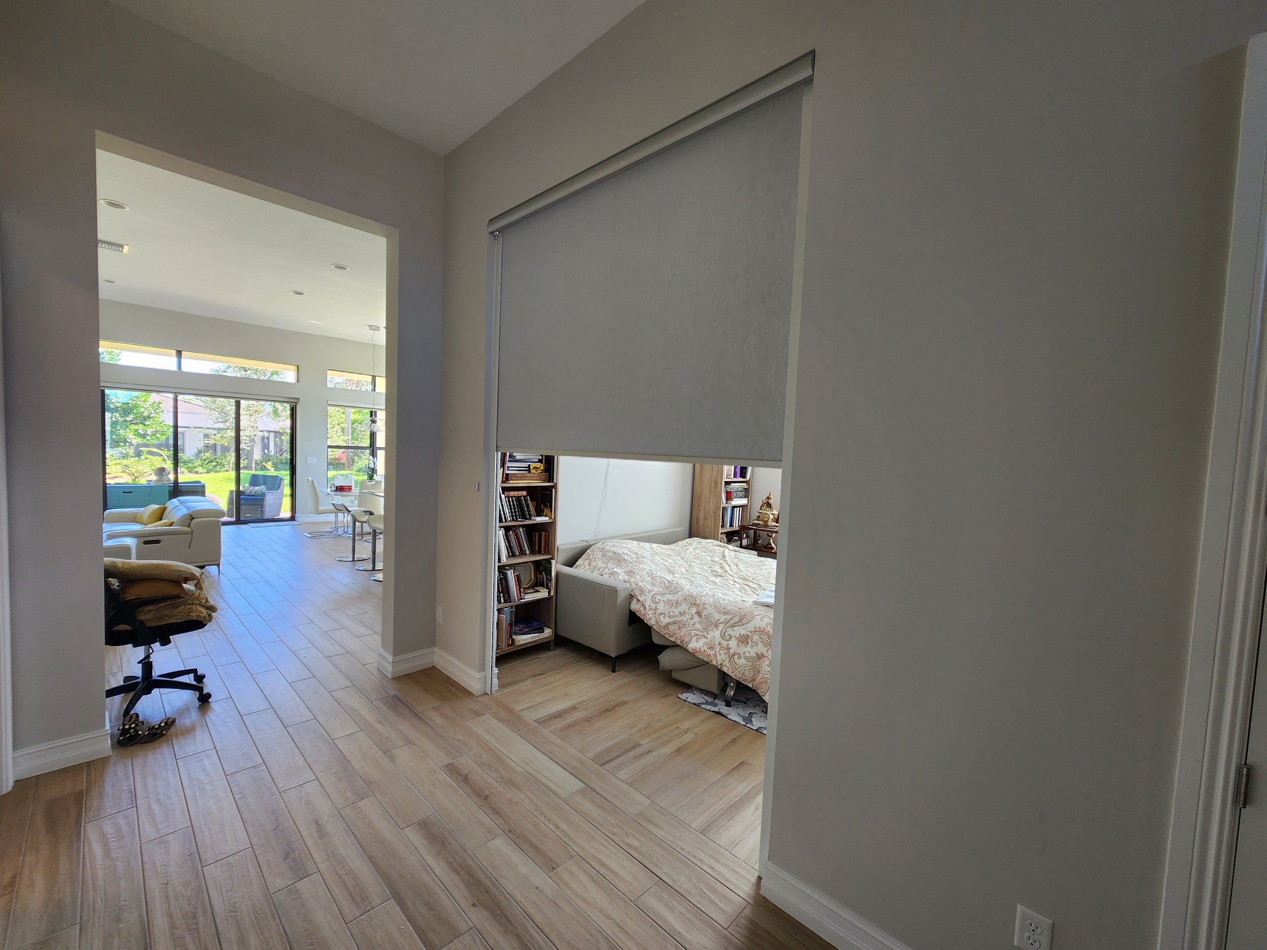 A privacy light filtering roller shade used to separate a living space from a room.
