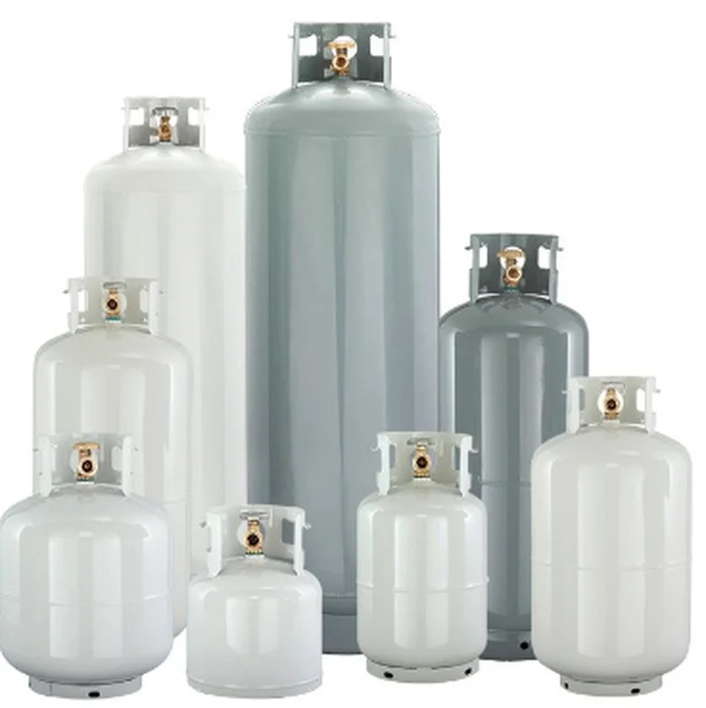 A collection of white and gray gas cylinders of various sizes with brass valves.