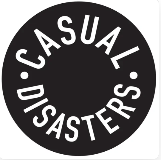 A circular logo with a black background and white text that reads 'CASUAL DISASTERS' in a curved shape.
