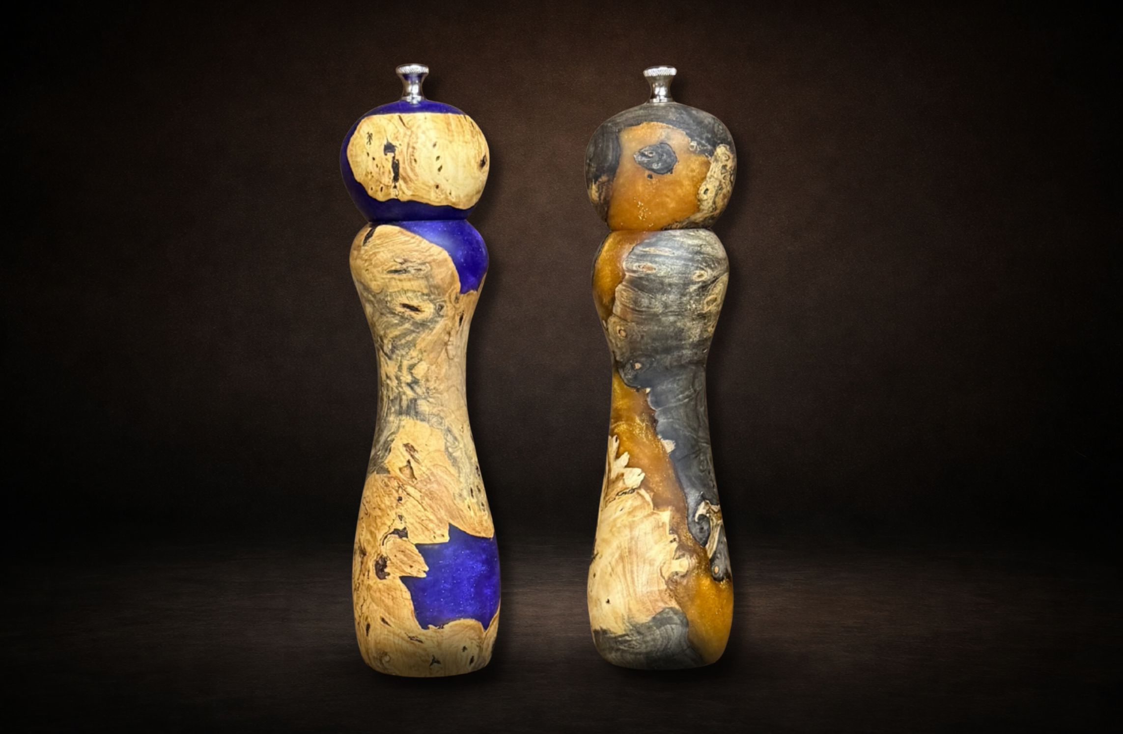 Hand turned peppermills made with epoxy filled buckeye burl wood.