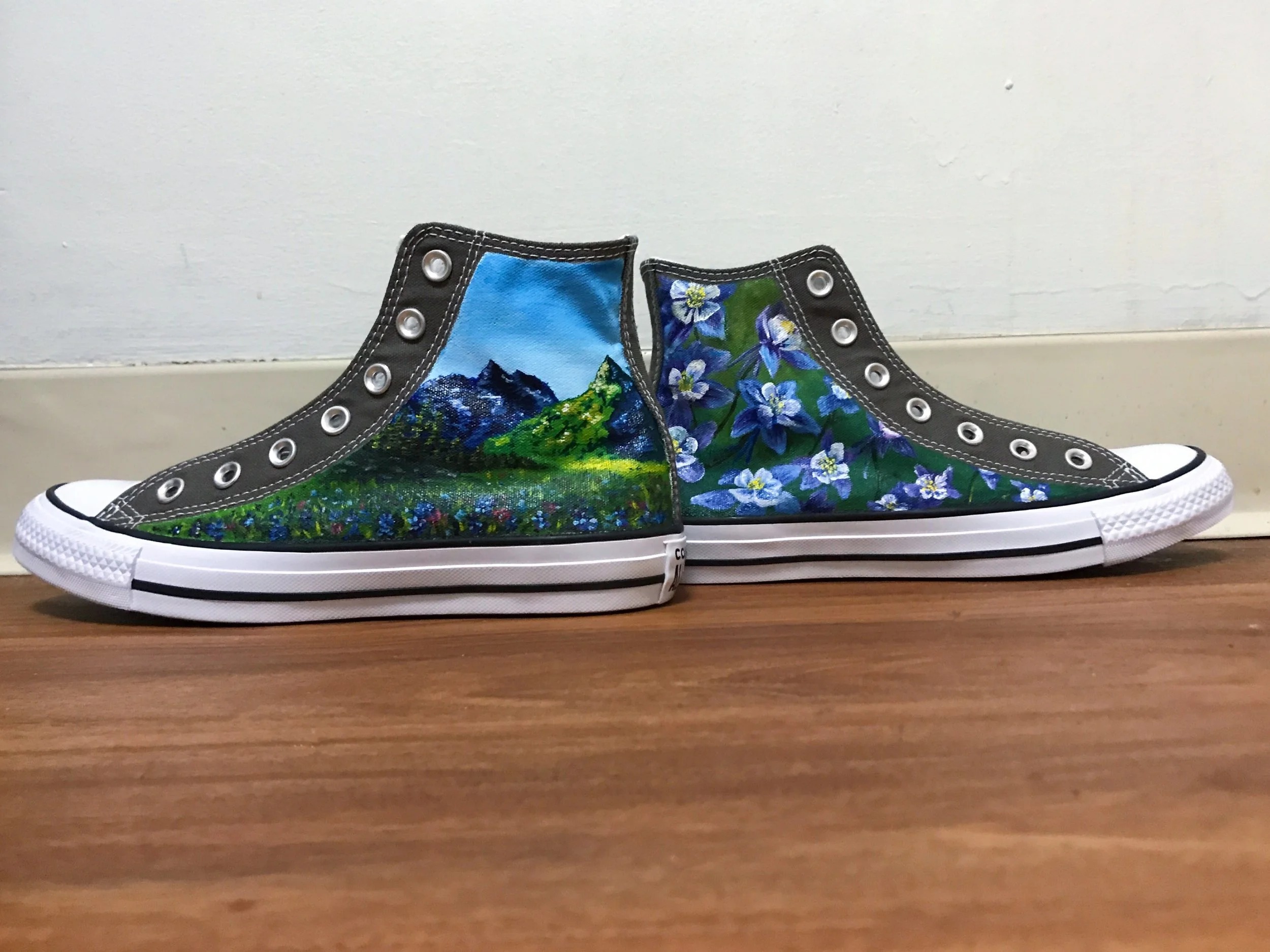 Painted Converse high tops hand painted with  mountain scenery and columbine flowers.