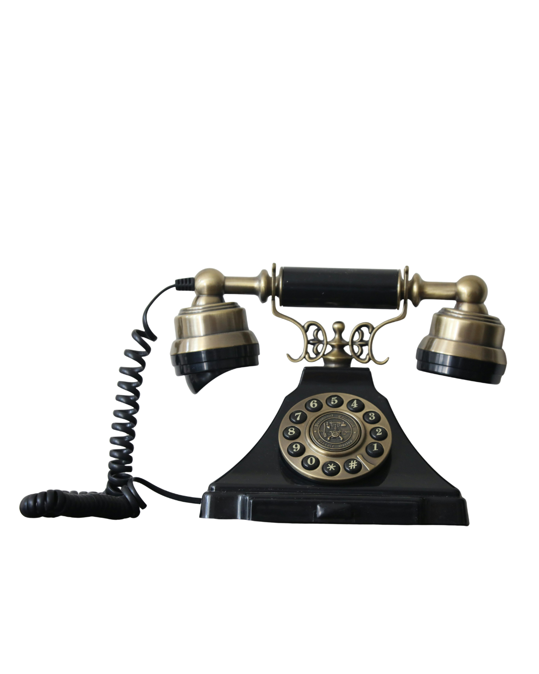 Vintage black rotary telephone with gold accents and a coiled cord