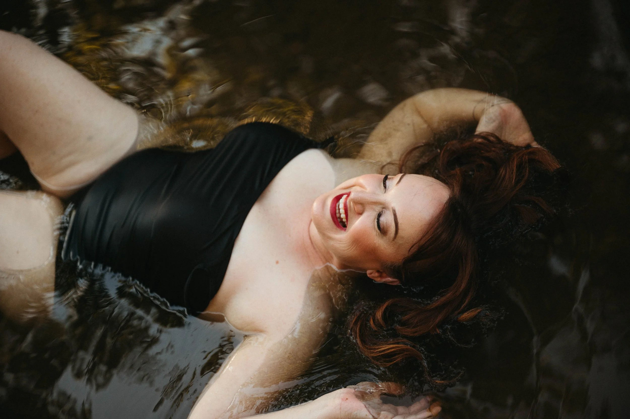 richmond-va-river-boudoir-laying-in-water.jpg