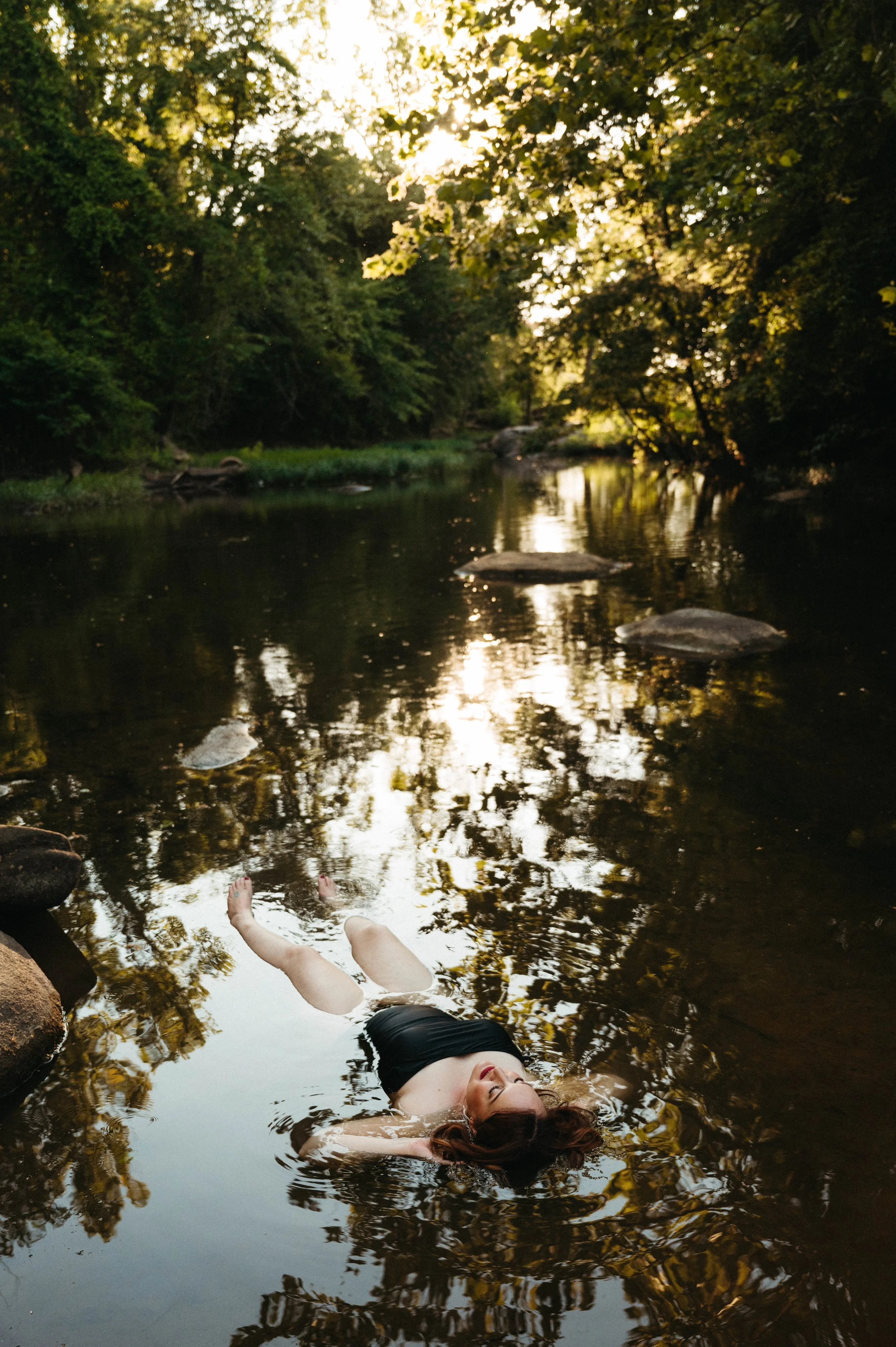 soft-river-boudoir-laying-in-water-golden-hour.jpg